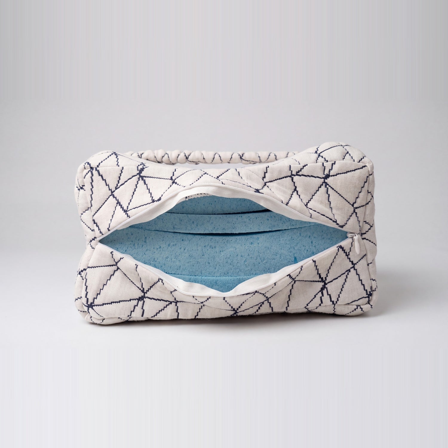 Cover unzipped showing the layered gel-infused memory foam inside