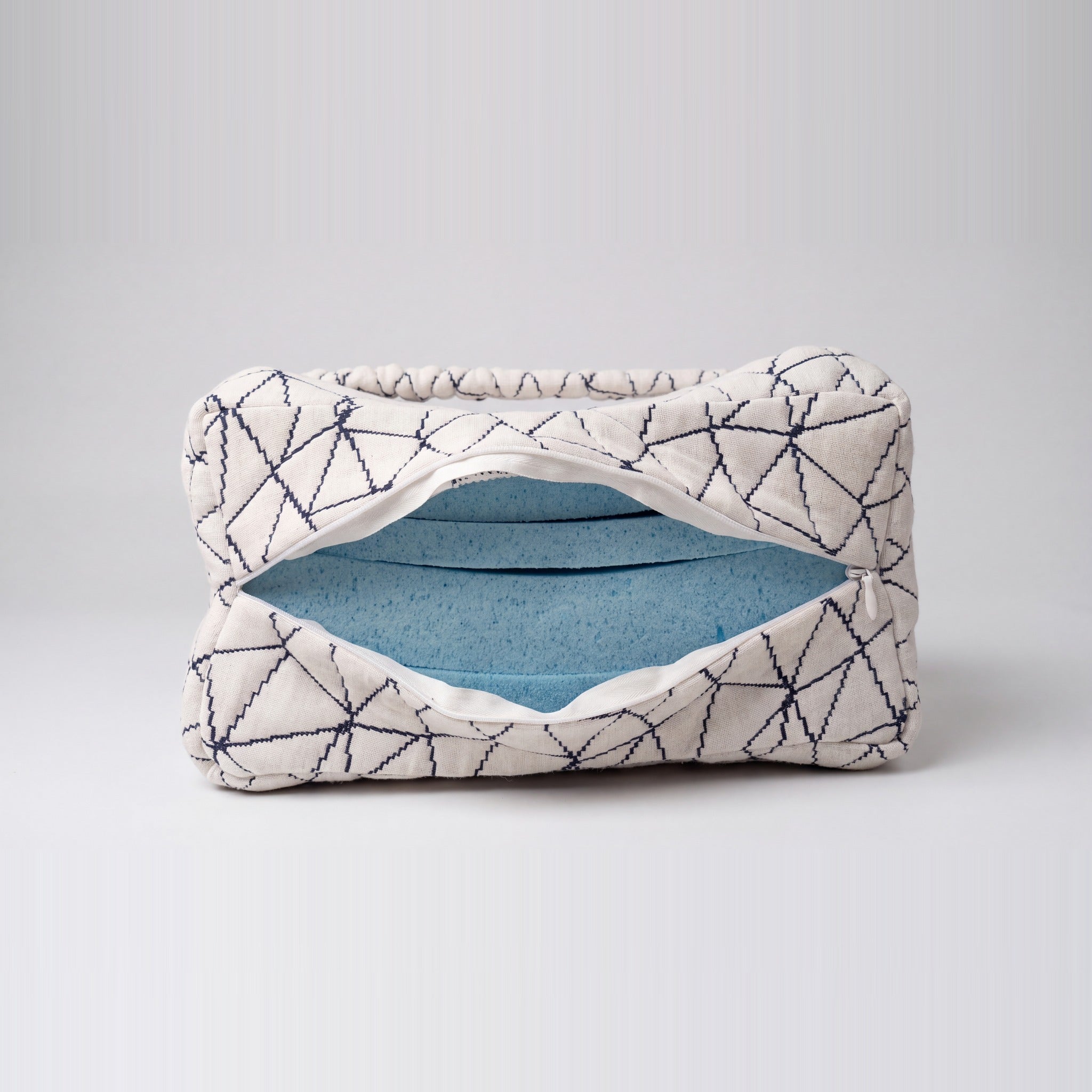 Cover unzipped showing the layered gel-infused memory foam inside
