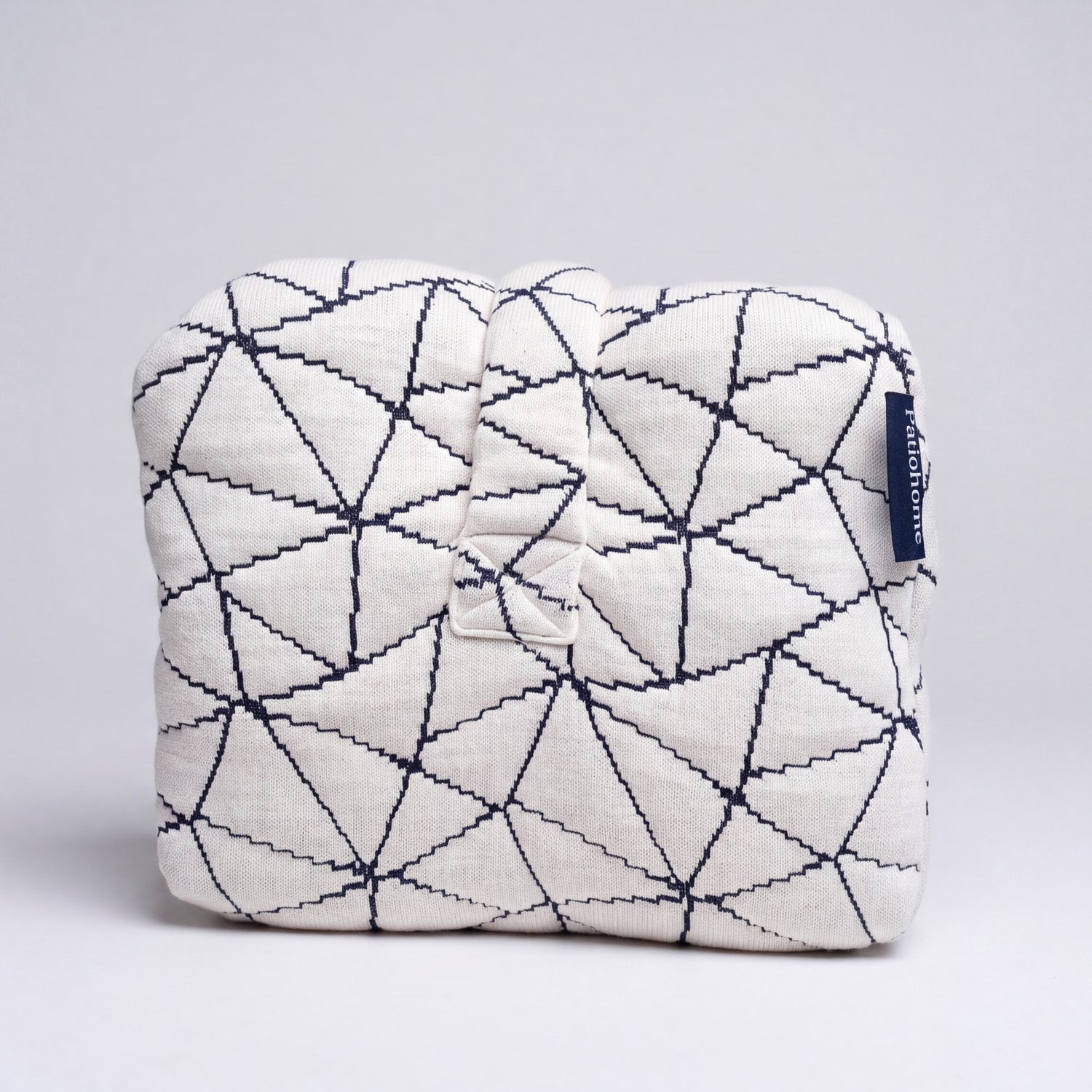 End view of the knee pillow with the strap and PatioHome label