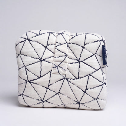 End view of the knee pillow with the strap and PatioHome label