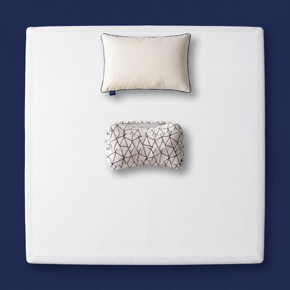 The Orthopedic Recovery Set - memory foam mattress topper, support pillow and knee pillow arranged on a made bed, viewed from above